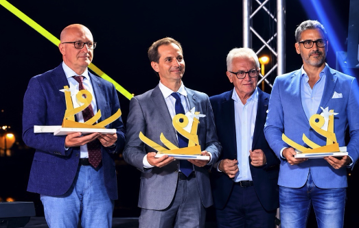 Michael Severance, Acton Institute (second from left) accepts the Liber@mente International Award alongside fellow honorees. 