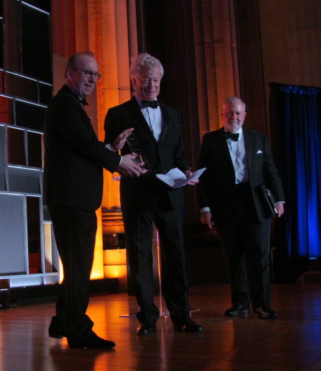 Sir Roger Scruton receives his award, alongside Roger Kimball and Larry Arnn.