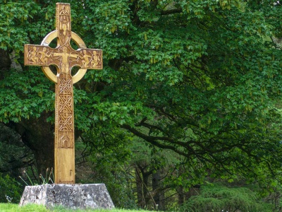 Celtic cross standing in a clearing 