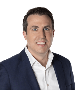 A headshot of John Tuttle